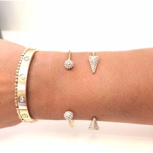 2 Henri Bendel gold open bracelets with stones